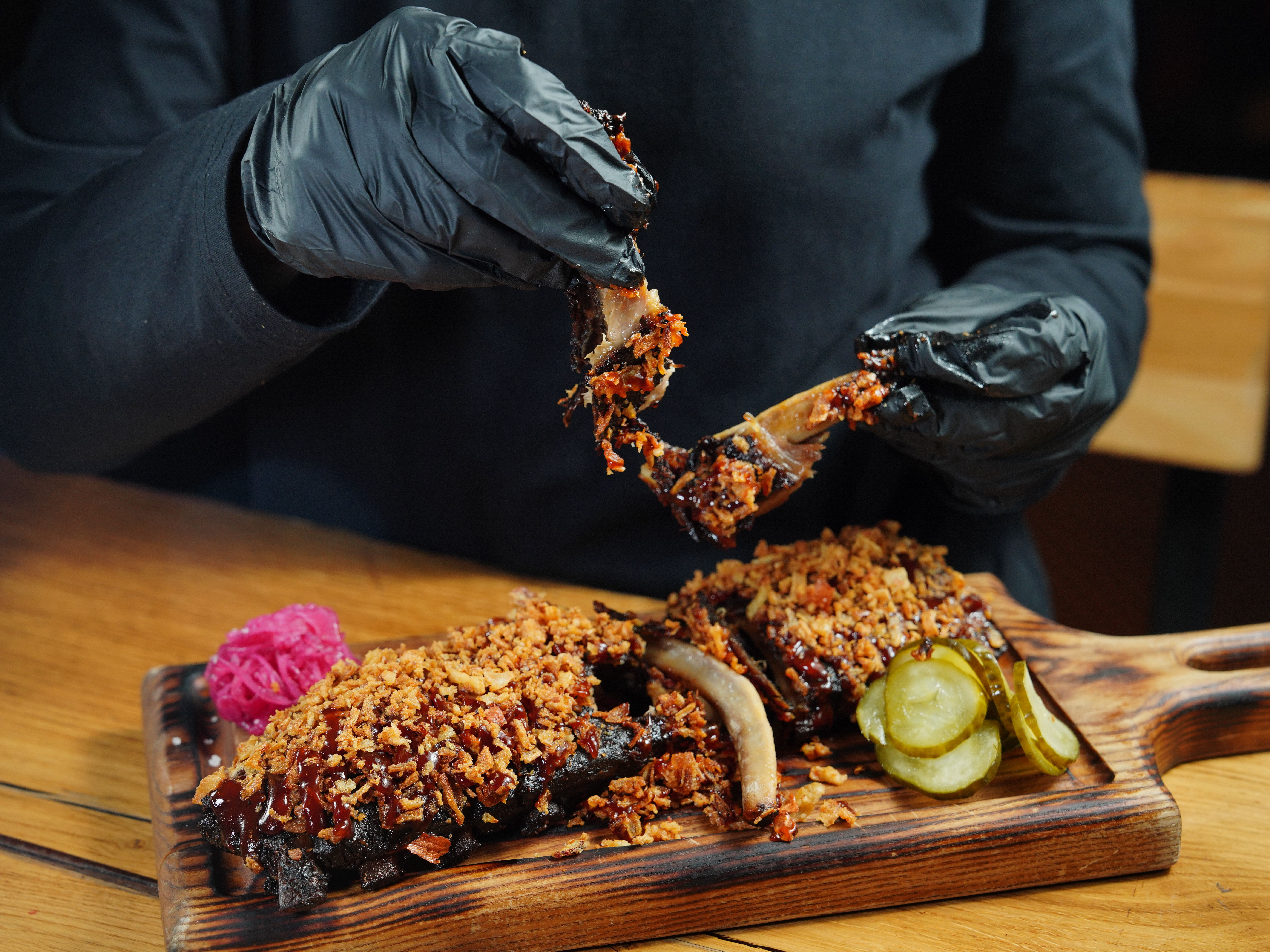 Chef Holding Roasted Ribs · Free Stock Photo