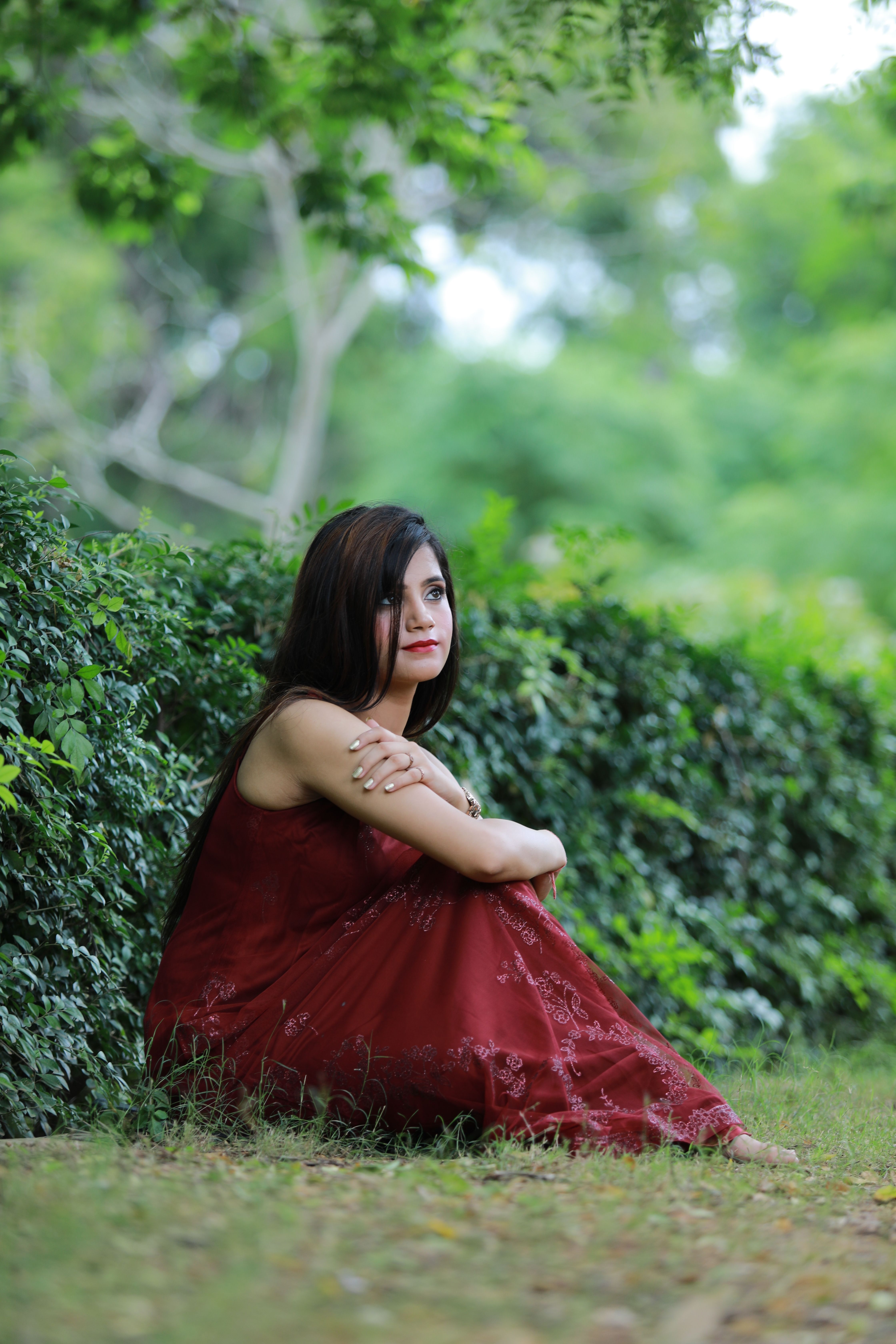Woman Wearing Burgundy Dress in a Park  Free Stock Photo