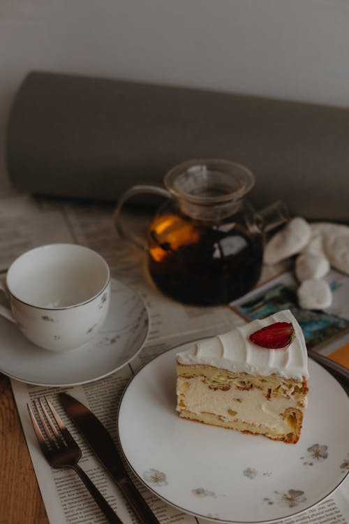 A Slice of Cake with Cream Filling on a Plate 