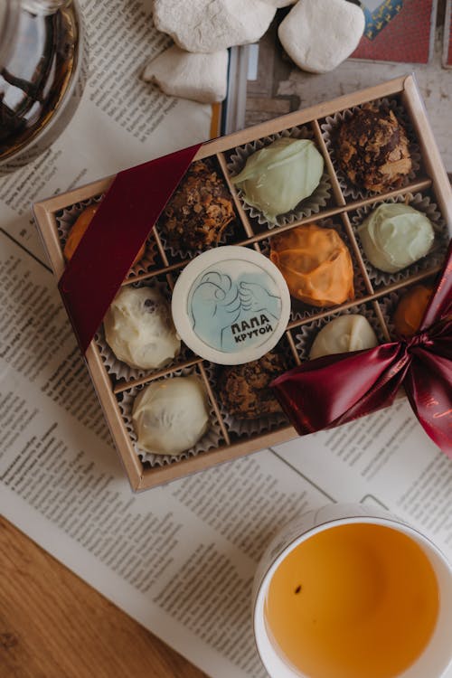 Box of Pralines and Tea on the Table