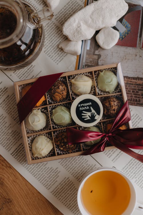 Box of Pralines and Tea on the Table