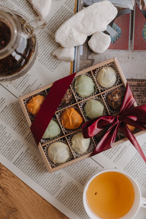 Box of Pralines and Tea on the Table