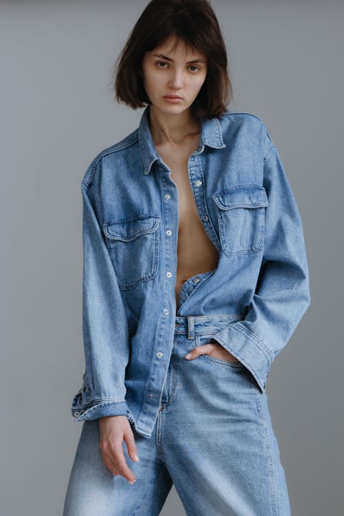 Young Brunette Woman Posing in Light Blue Denim Shirt and Jeans