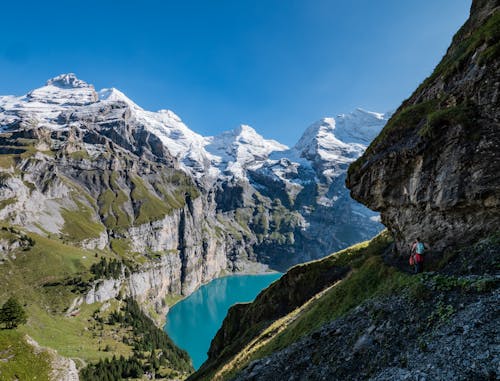 Hiking on a Mountain Trail in the Bernese Alps Above the Oeschinen Lake in Switzerland