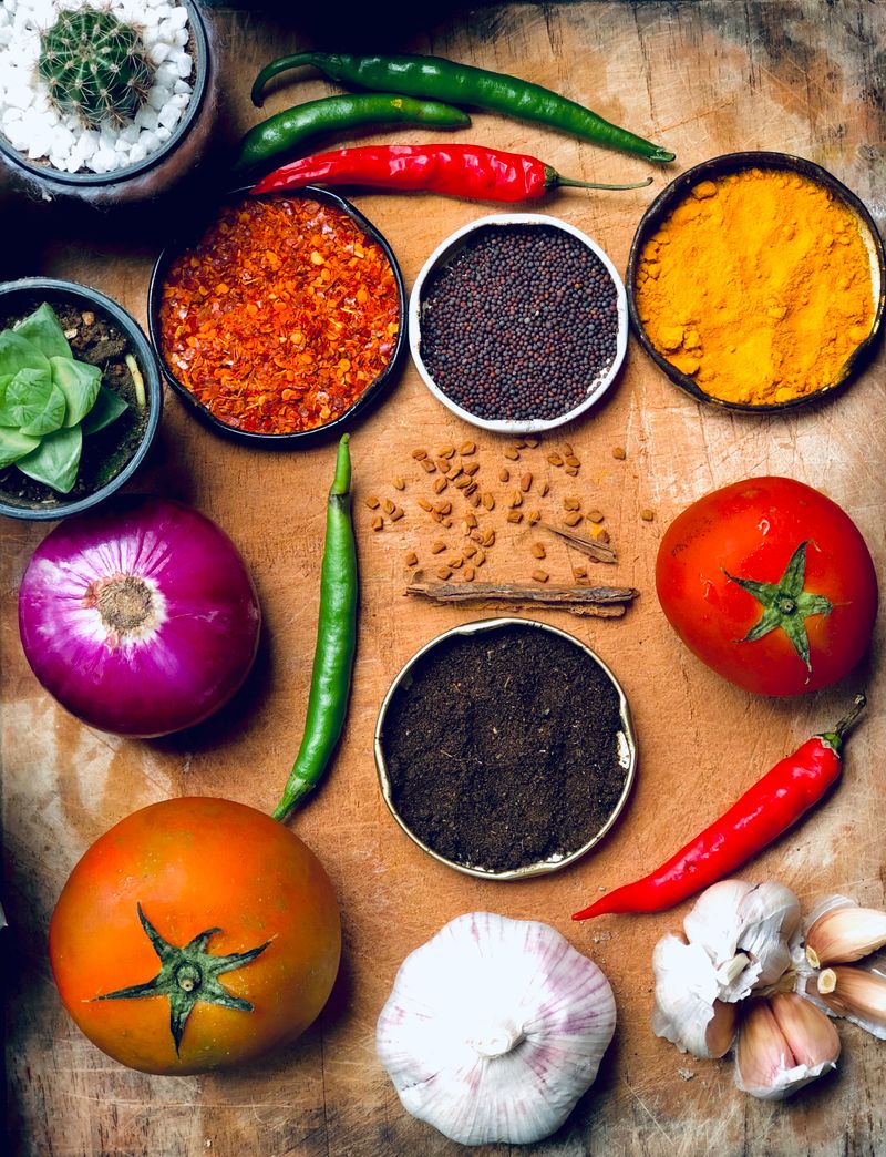 Fresh spices and vegetables on a wooden tray — Soul Panda quality ingredients without compromise