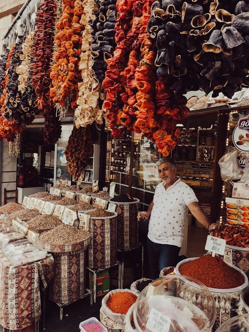 Man Selling Spices and Herbs on a Bazaar