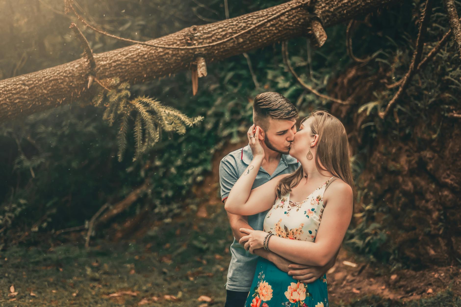 Couple Kissing Passionately In A Warm, Vibrant Setting