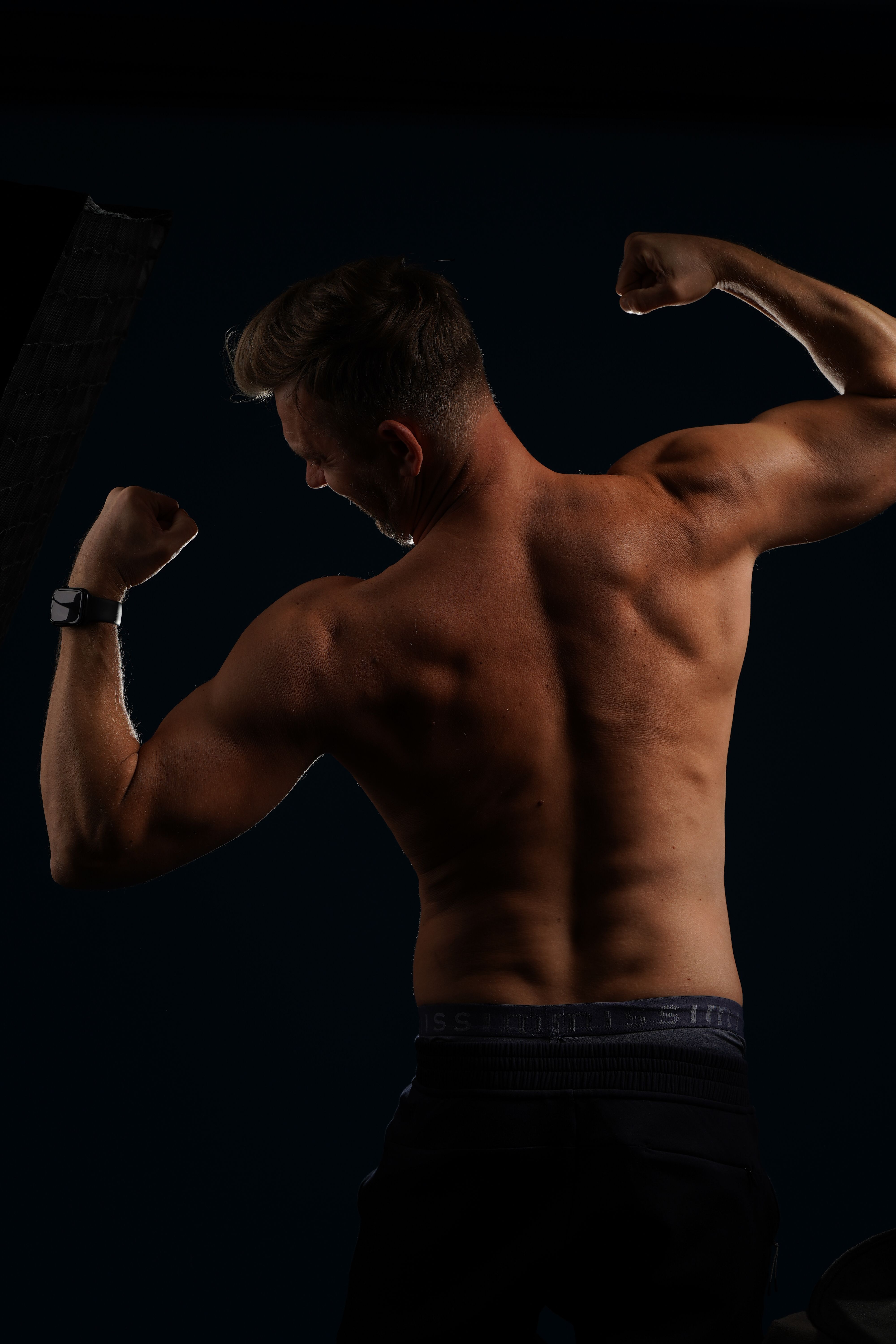 Shirtless Man Flexing Muscles · Free Stock Photo