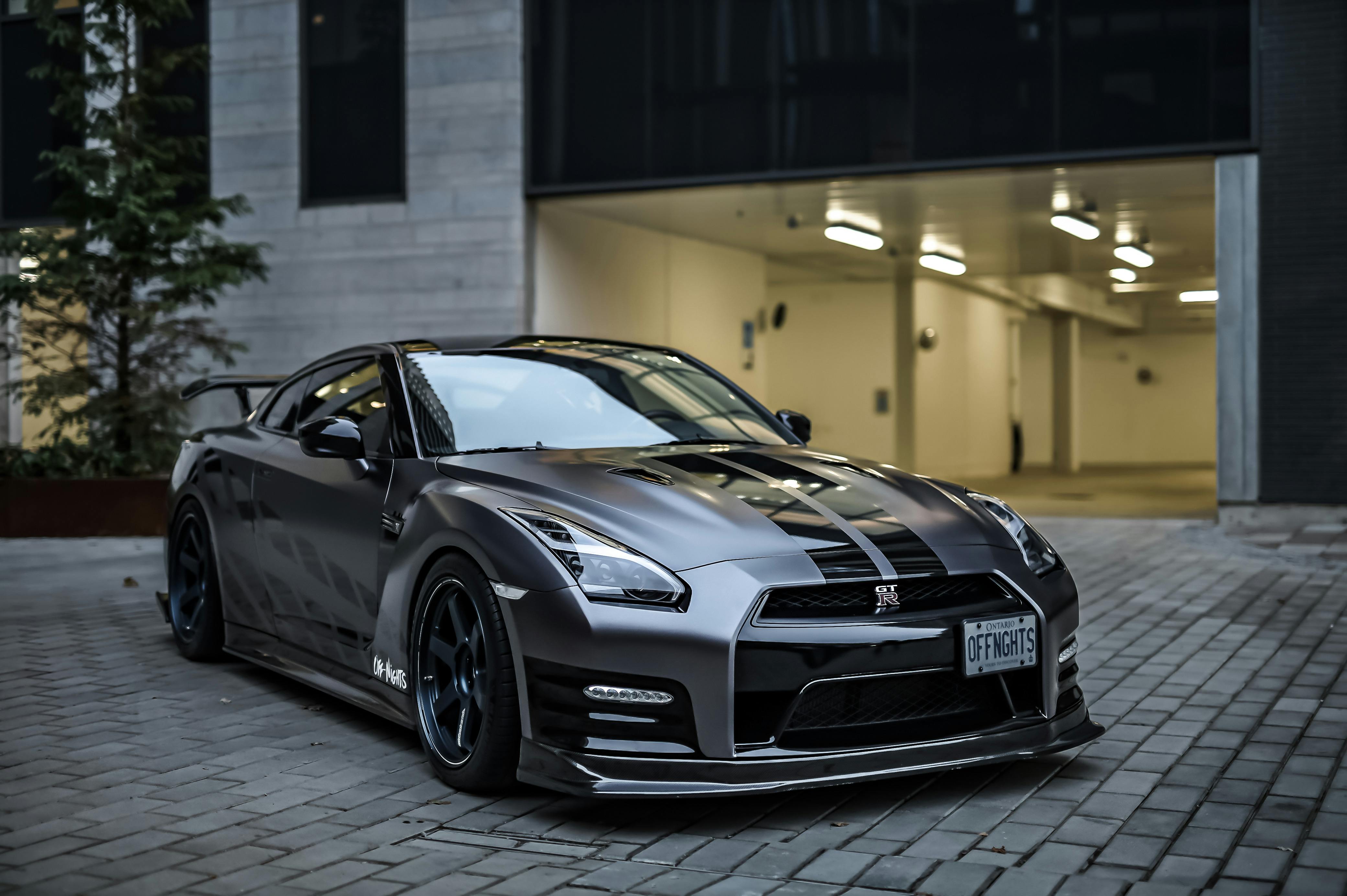 Silver Toyota Supra Parked under Garage Entrance · Free Stock Photo