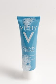 Vichy Aqualia Thermal hydrating cream in a foamy blue tube on white background.