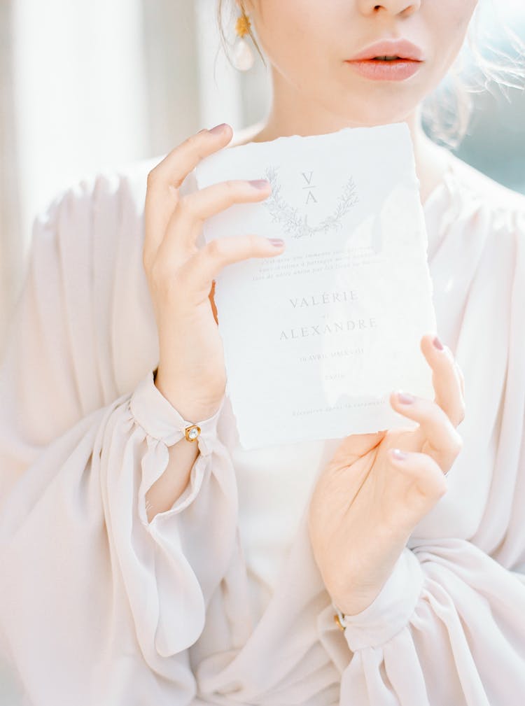 Woman Holding A Wedding Invitation 