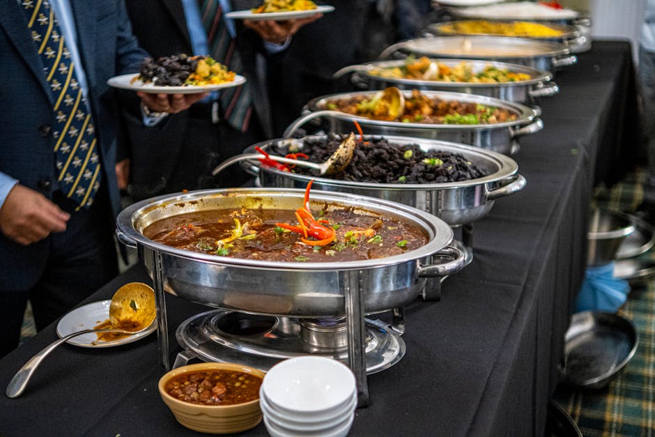 buffet line setup with various catering equipment including chafing dishes, beverage dispensers, and serving stations - wholesale catering equipment