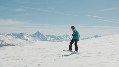 Person Snowboarding in Winter