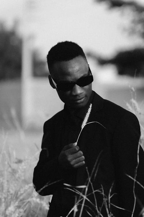 Man in Sunglasses and Black Clothes in Black and White