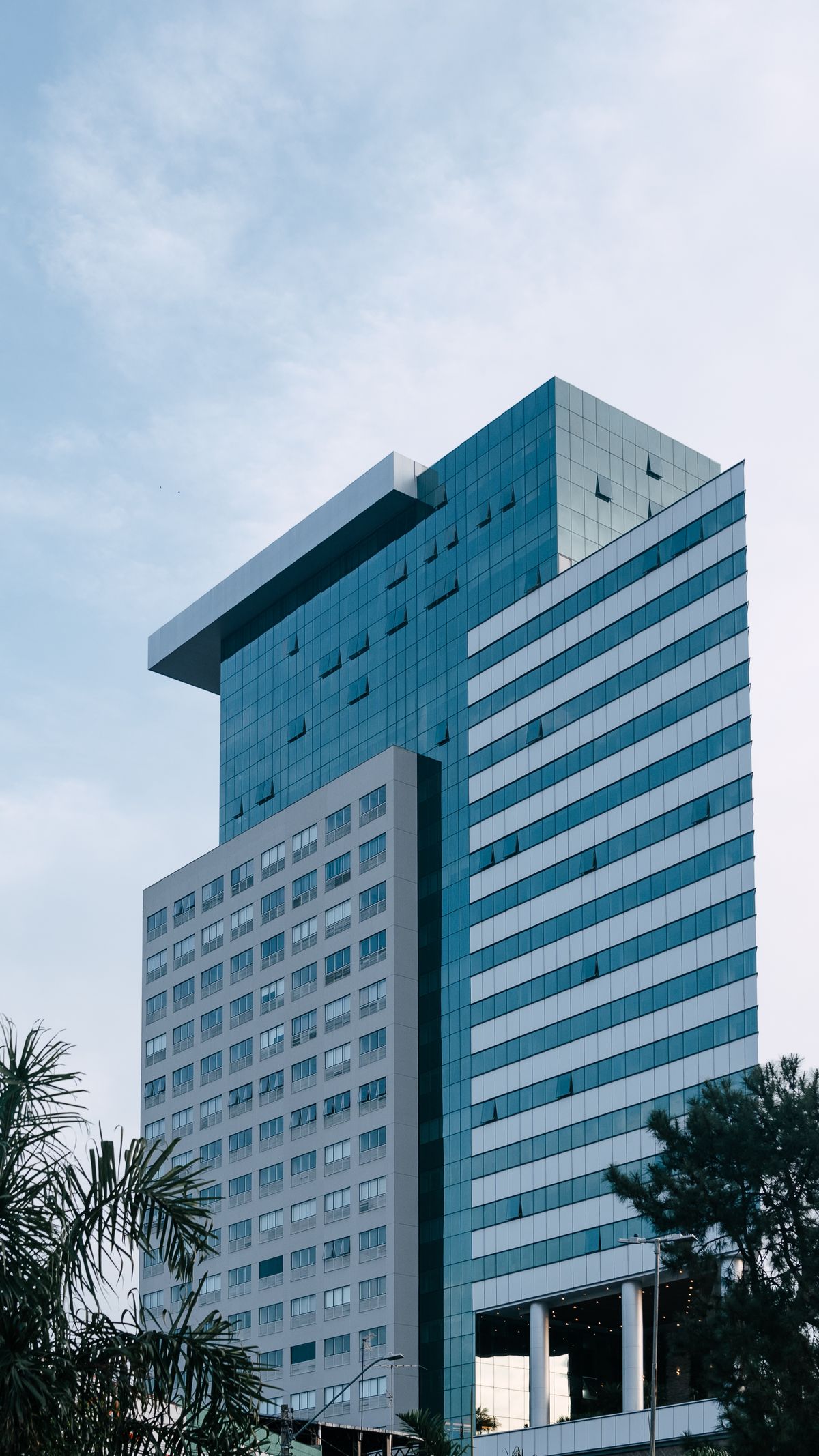 Orbiqe Technologies — modern glass office tower