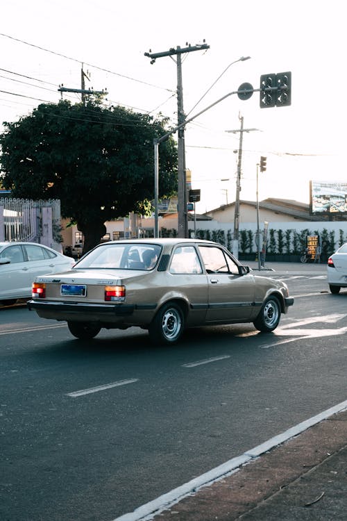 Brown Classic Car in Street