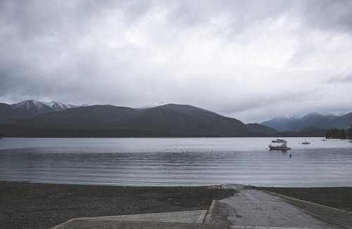 Sailboats on a Lake in a Mountain Valley