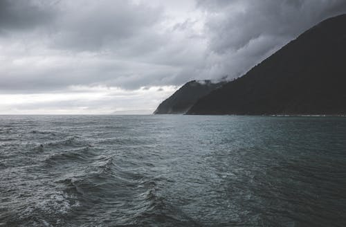 Mountains Covered with Clouds by the Sea