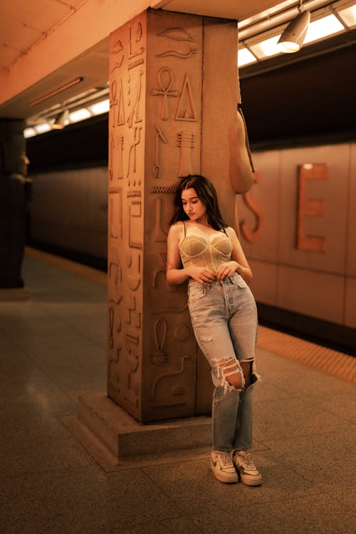 Photo of a Girl Posing on an Underground Station