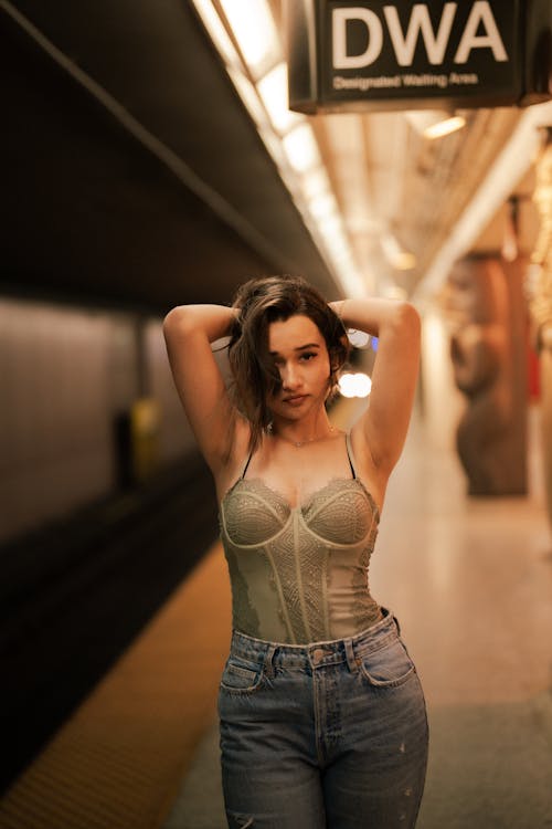 Photo of a Girl Posing on an Underground Station