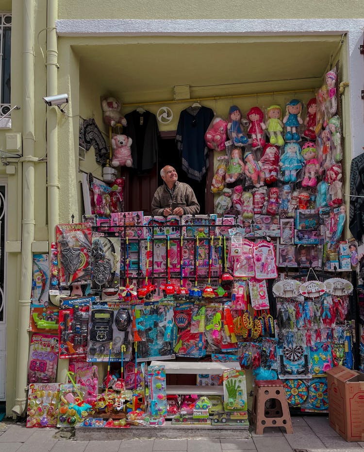 Man Selling Toys From Balcony