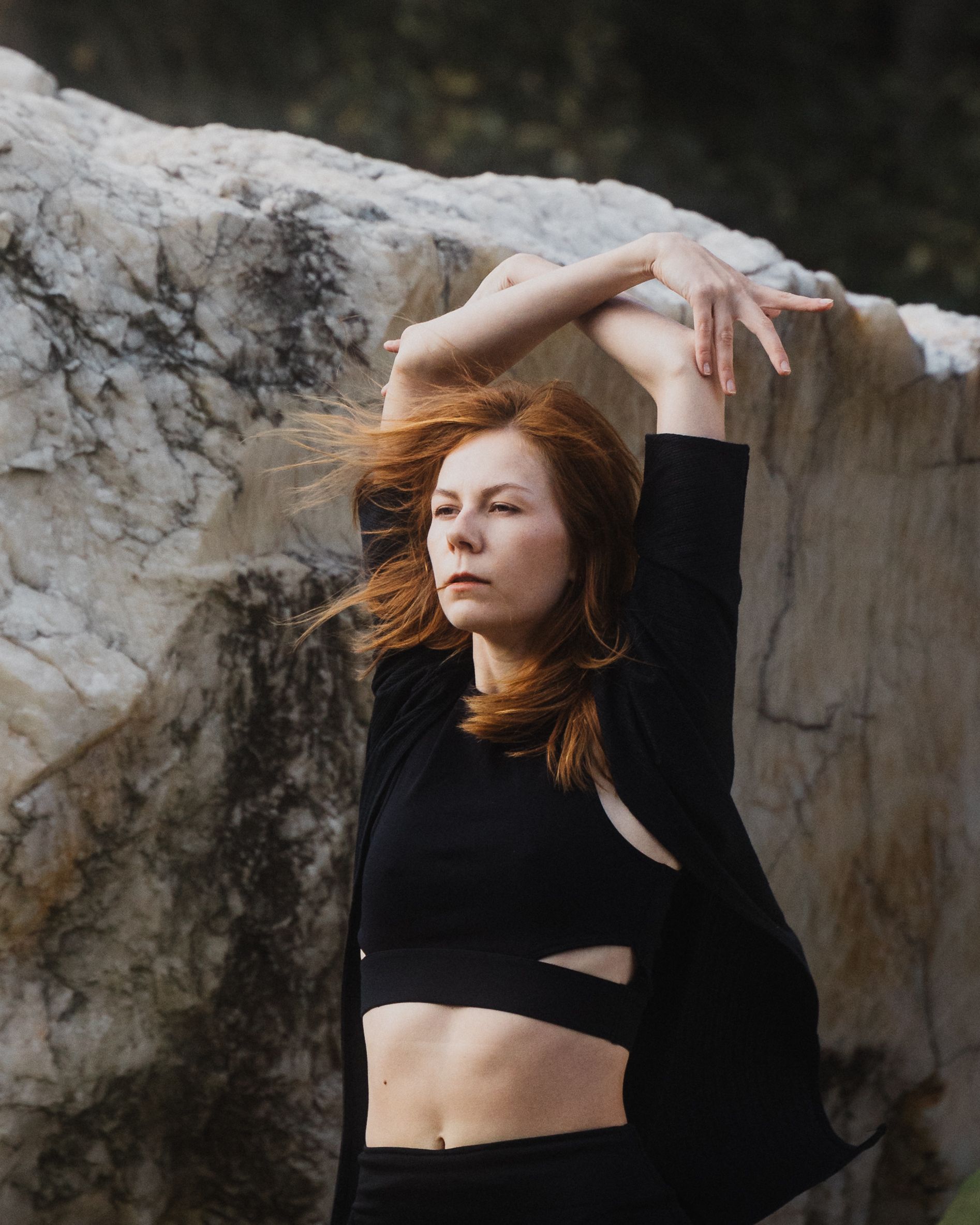 Redhead Model Posing with Arms Raised · Free Stock Photo