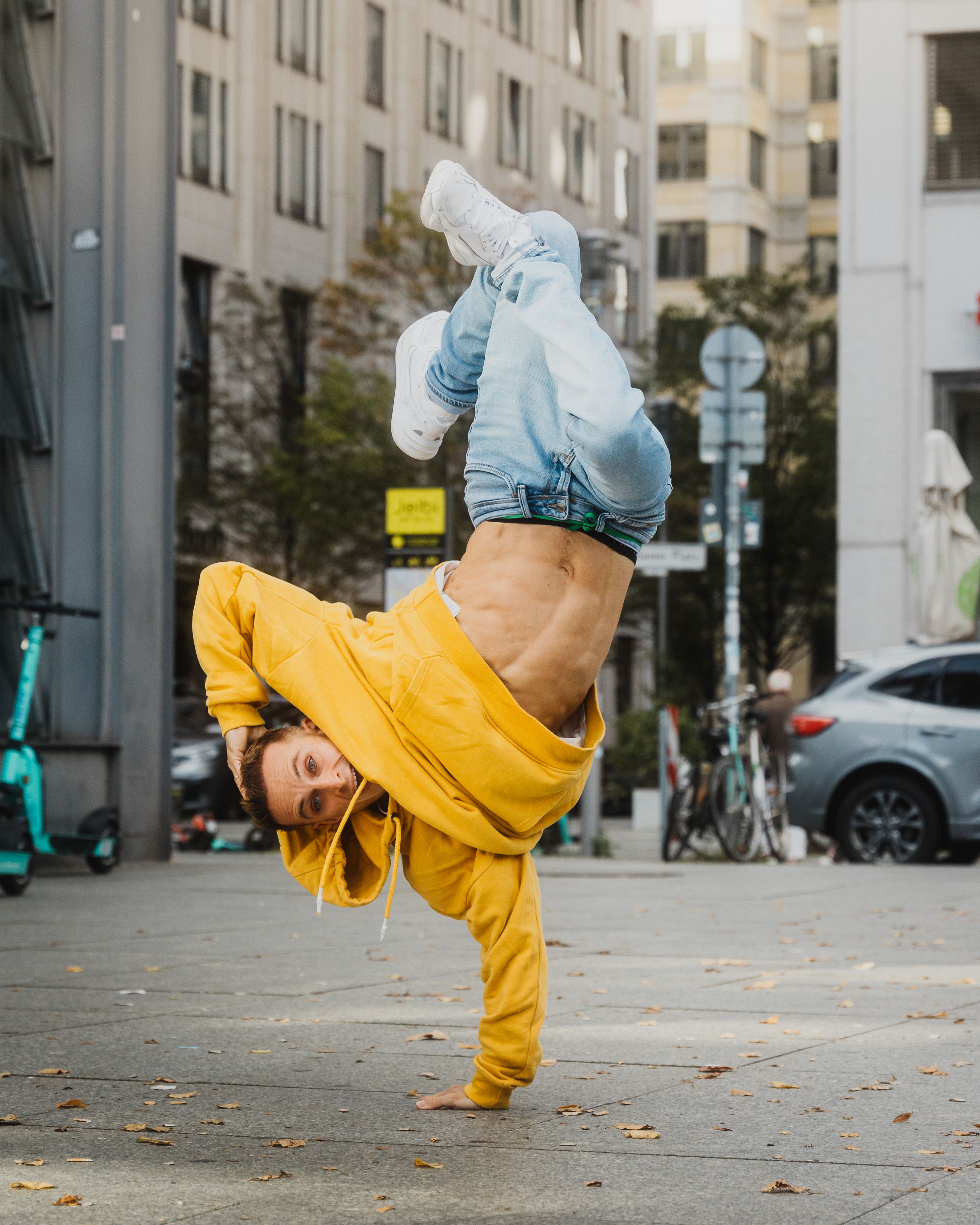 Breakdancer Standing on One Hand on the Sidewalk · Free Stock Photo
