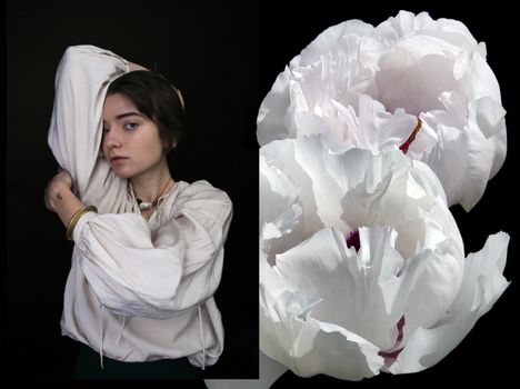 Elegant portrait of a young woman in white beside blooming white peonies on a black background.