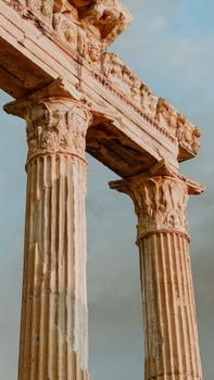Elegant marble columns of the Apollo Temple against a blue sky in Side, Turkey.