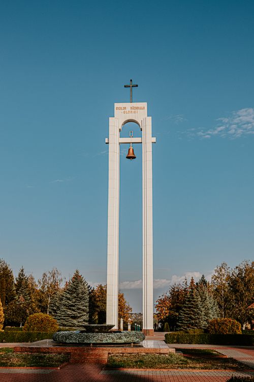 Free Explore the Serpeni Memorial Bell Tower, a prominent landmark in Moldova's serene park setting. Stock Photo
