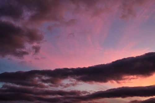 Free Stunning cloudscape at dusk with vibrant pink and purple hues over Penrith, England. Stock Photo