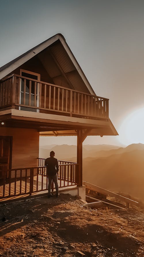 Free Person Standing Outside The House Stock Photo