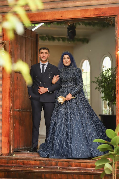 Free Newlyweds Standing Together in Doorway Stock Photo