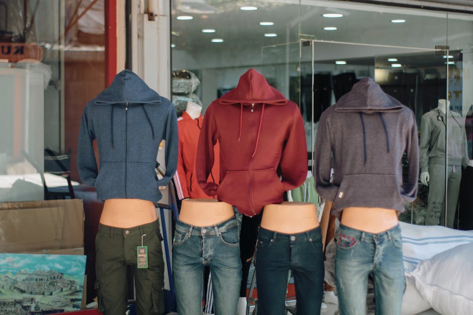 A group of mannequins wearing hoodies and jeans