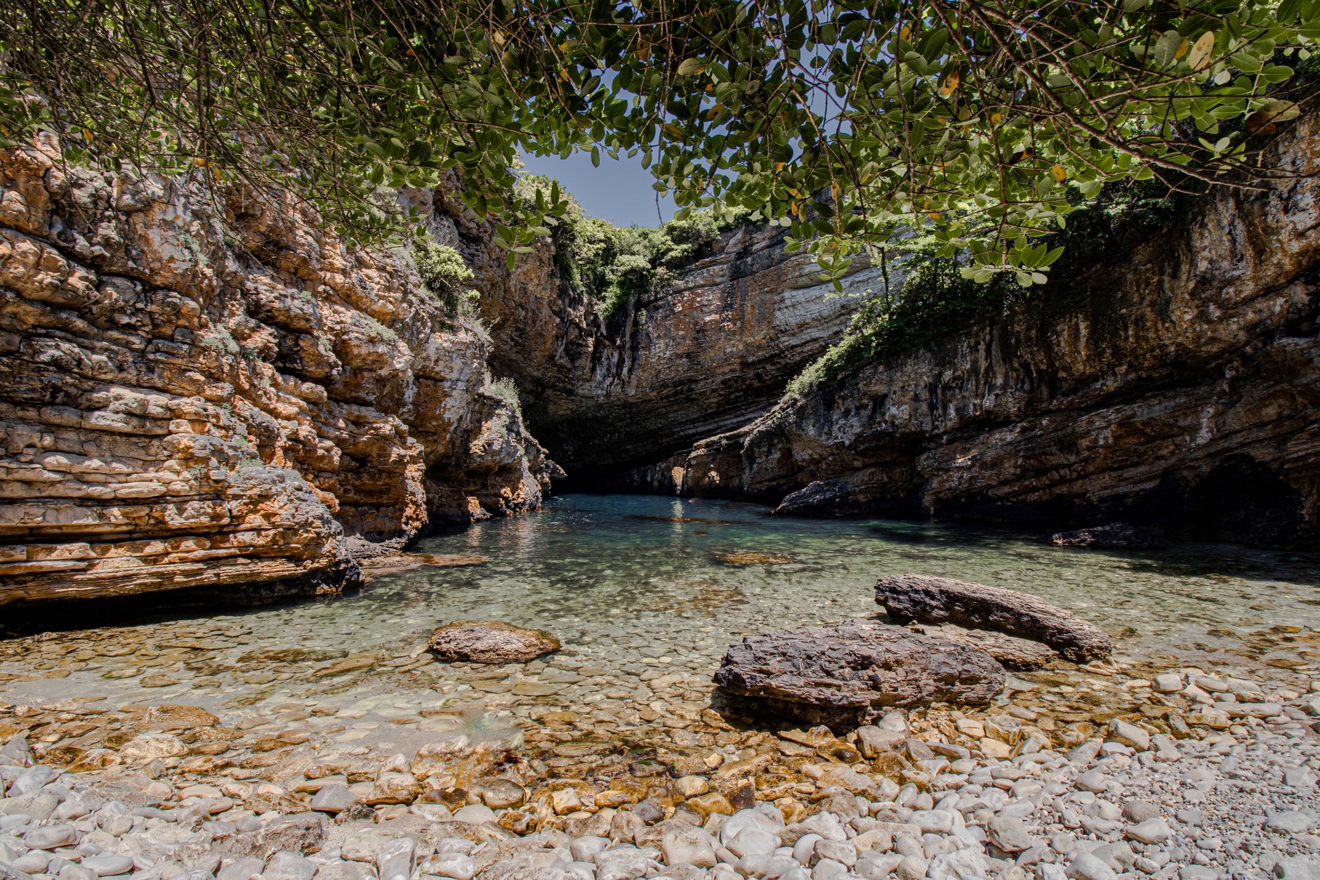 Discover the serene beauty of a rocky cove in Kocaeli, Türkiye, with crystal clear waters.