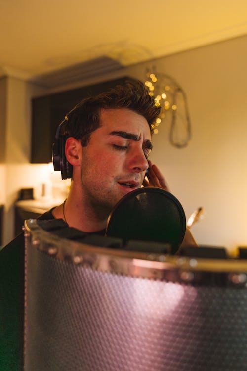 Man with Headphones on Singing in his Room 