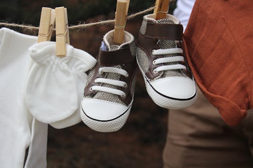 Close-up of Baby Shoes on Clothesline