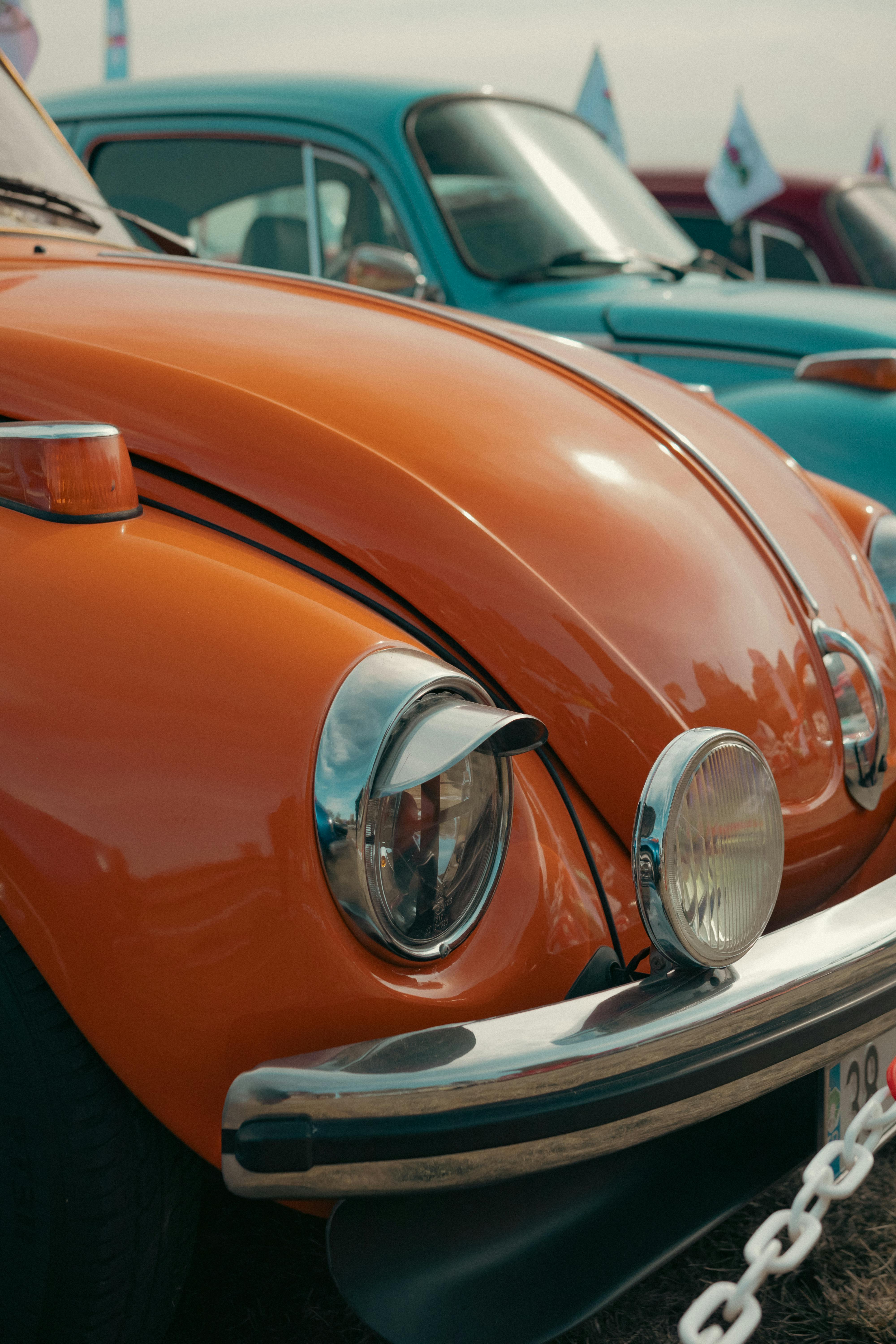 hood of an old volkswagen beetle with visors on the headlights