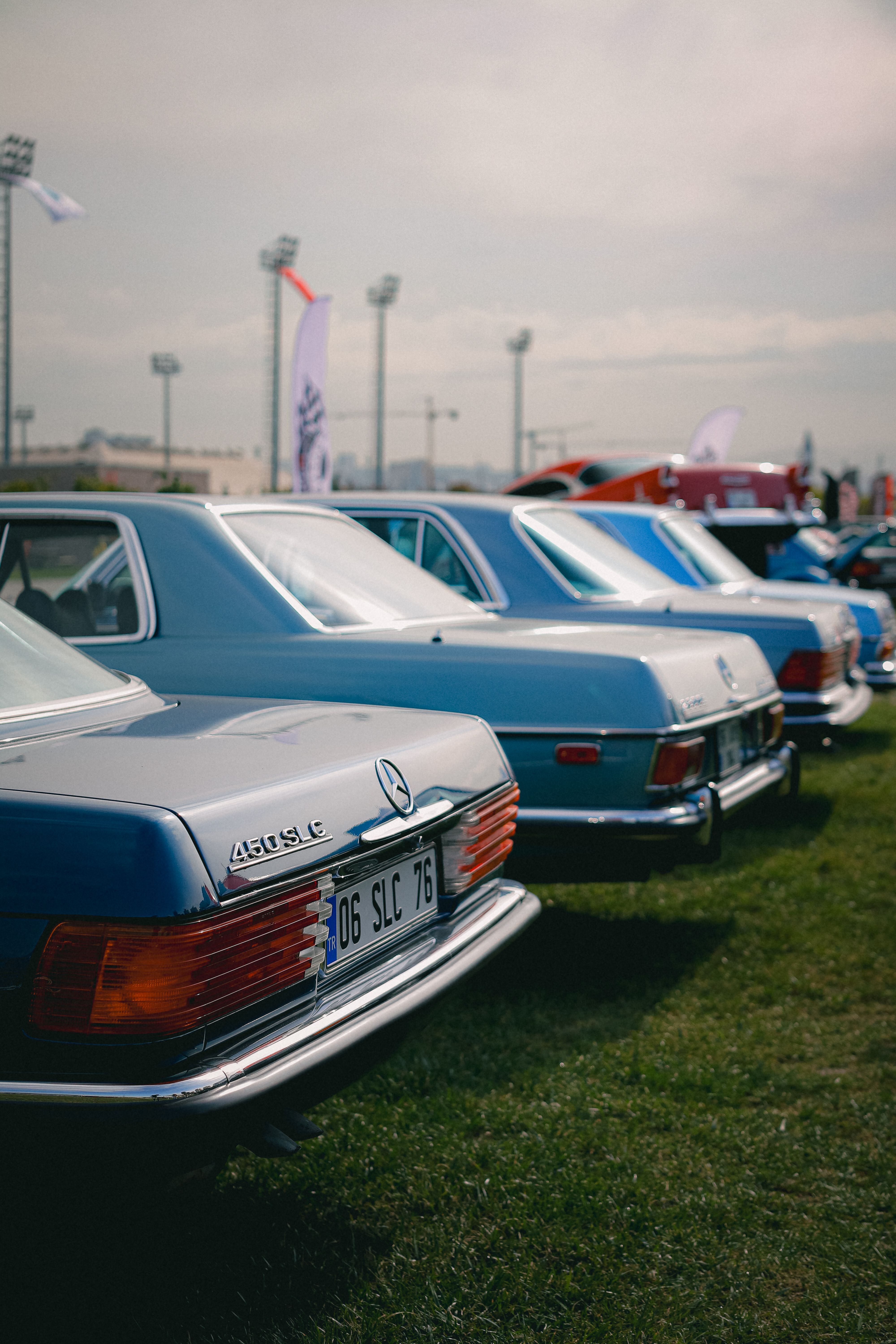 Trunks of Classic Mercedes Cars Lined up at a Car Show · Free Stock Photo