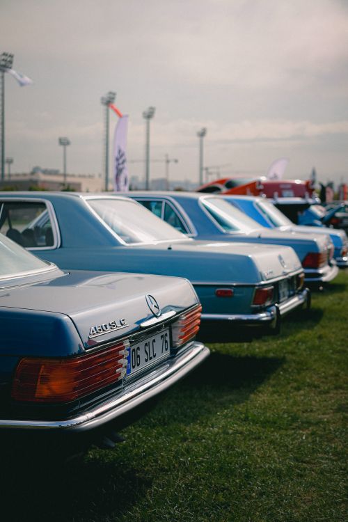Free Collection of vintage Mercedes-Benz vehicles on display outdoors at a classic car show. Stock Photo