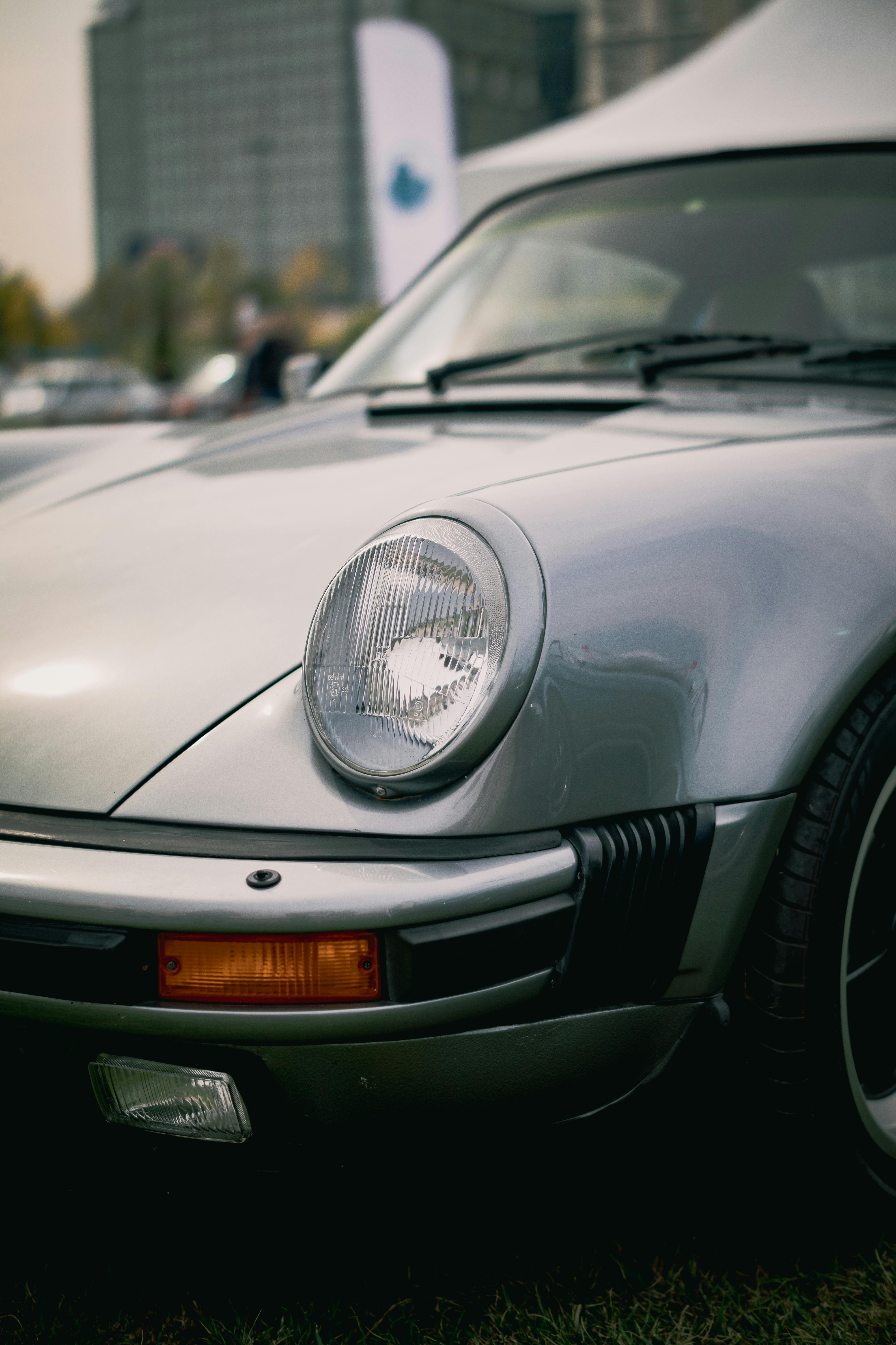 Premium Photo | A black porsche 911 with a city skyline in the background