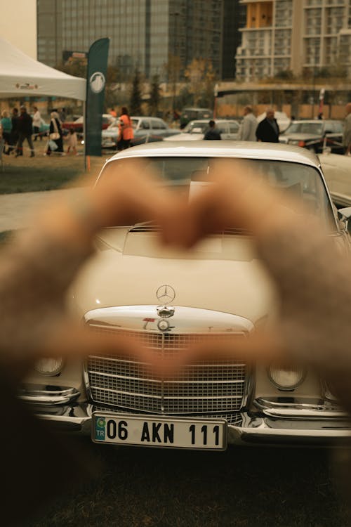 Hand Heart in Front of Mercedes W115 at a Car Show