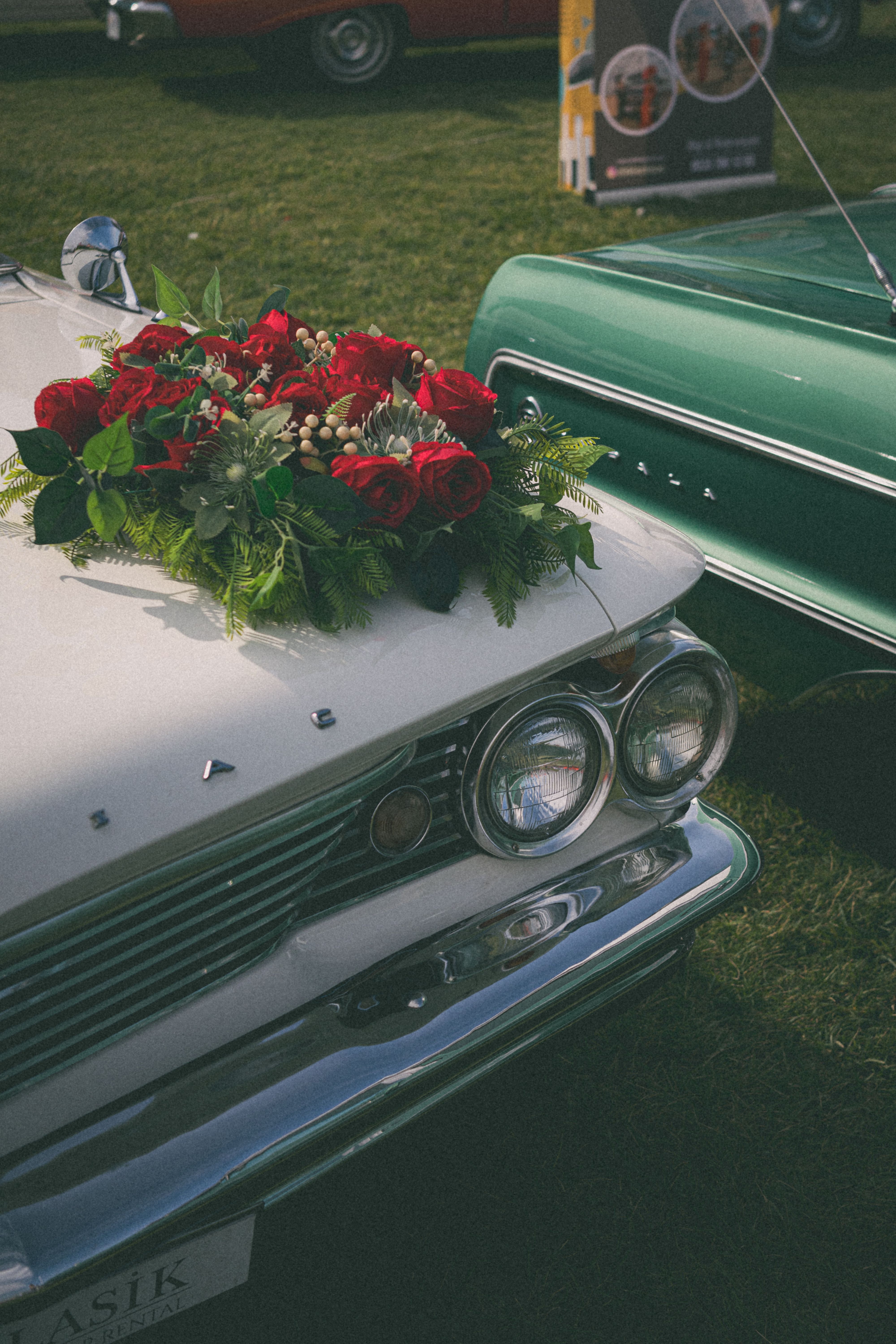 Bouquet of Red Roses on Hood of Cadillac · Free Stock Photo