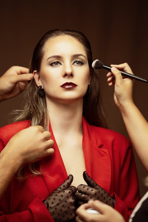 Portrait of a Woman Getting Her Makeup Done 