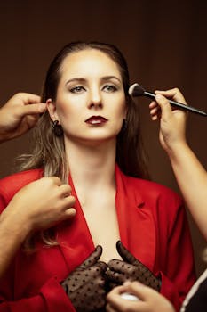 Elegant portrait of a young woman in a red outfit, styled and poised in a studio setup in Argentina.