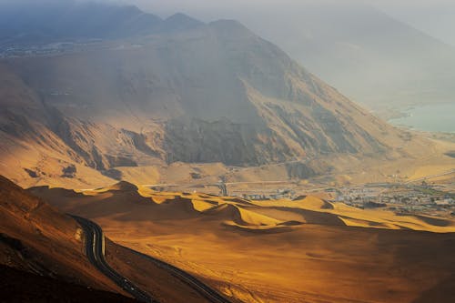 Road and Town under Hill on Desert