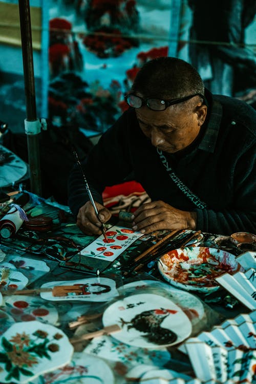 Artist Sitting and Painting