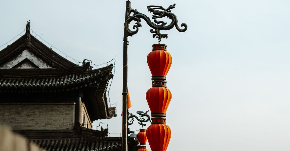 Stunning view of Xi'an City Wall adorned with traditional red lanterns, capturing local heritage.