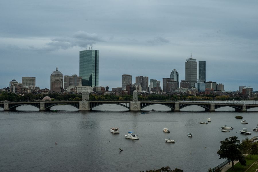 Boston skyline with Longfellow Bridge spanning the Charles River, featuring iconic Back Bay and downtown buildings