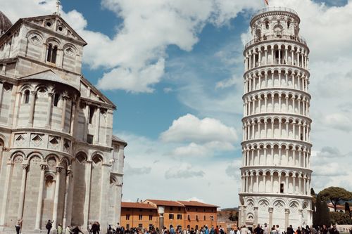 Free Capture of the Renaissance Pisa Cathedral and famous Leaning Tower of Pisa under a clear sky in Italy. Stock Photo